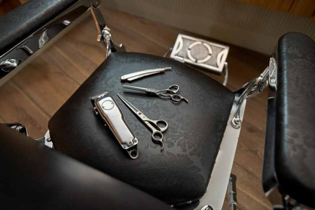 hairdressing-tools-on-leather-chair-in-barbershop-2023-08-17-18-48-01-utc